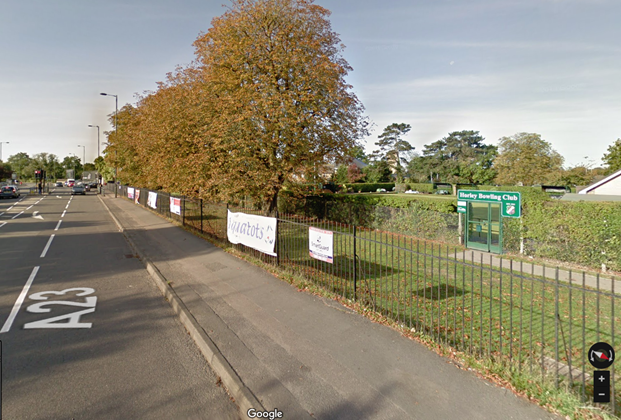 Google Maps street view image of the railings alongside the Horley Recreation Ground, with banners clearly visable
